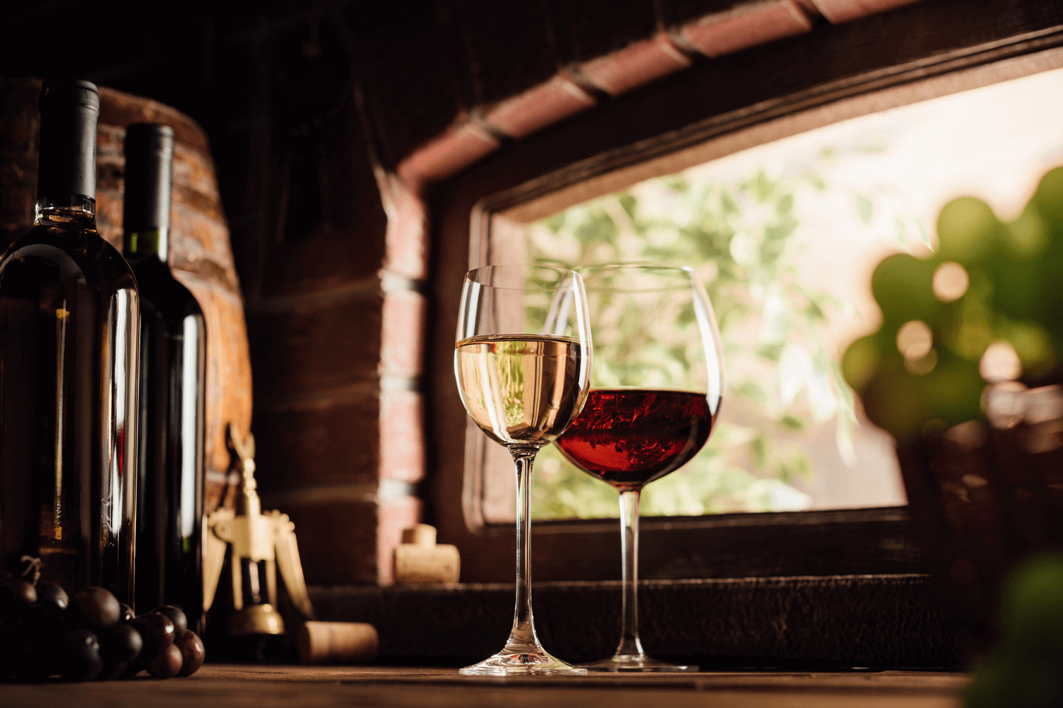 Two glasses of wine sitting on the edge of a windowsill in Concord, MA restaurant