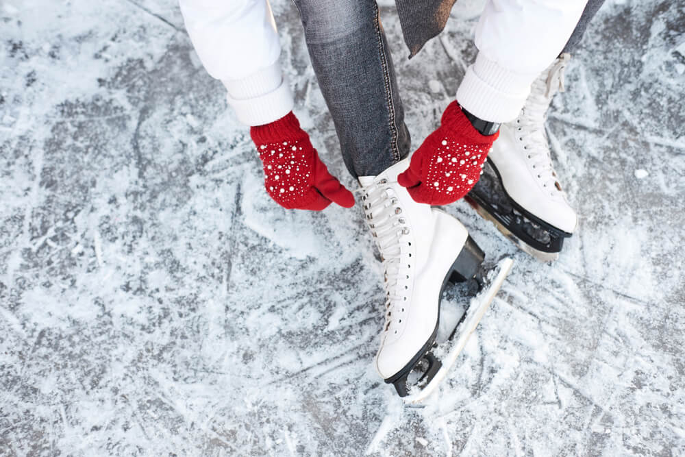 Photo of a Woman Lacing up Her Skates in Concord, Massachusetts, During Winter's Hearth.